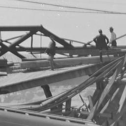 Crowds Looking at a Bridge ...