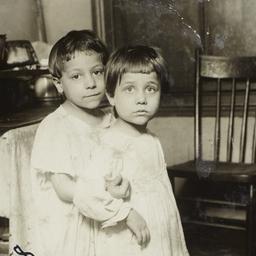 Two Children Beside a Stove