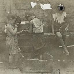 Four Boys near Wooden Fence