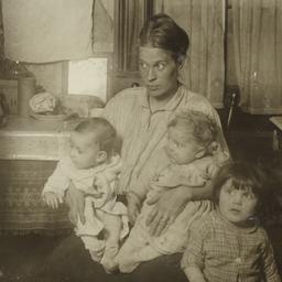Seated Mother with Three Ch...