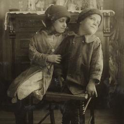 Two Children on Broken Chair