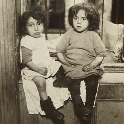 Two Little Girls on Windowsill