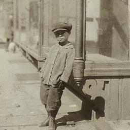 Boy Leaning against Window