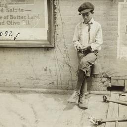 Boy Leaning against Wall