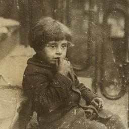 Child Sitting on Stoop