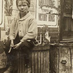 Boy on Trash Can