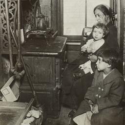 Woman and Children near Stove