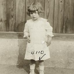 Girl near Wooden Fence