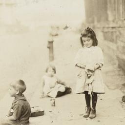 Three Children near Wooden ...