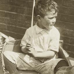 Boy Sitting in Cardboard Box