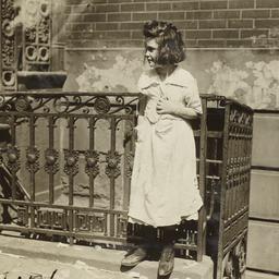 Girl and Two Boys near Gate