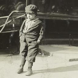 Boy in Front of Bread Shop