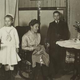 Woman Sewing with Children ...