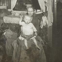 Mother Holding Child with W...