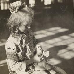 Girl with Doll in Empty Room