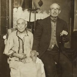 Old Man and Woman Holding H...