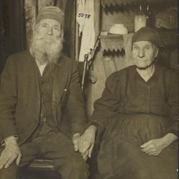 Seated Couple Holding Hands