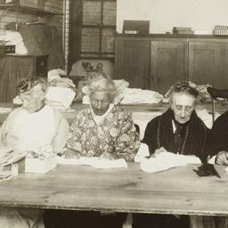 Old Women Sewing