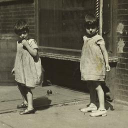 Twin Girls on Sidewalk