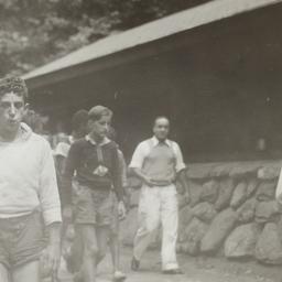 Boys Walking near Cabin