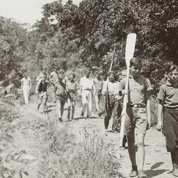 Boys Walking with Oars