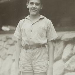 Boy in Front of Cabin