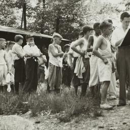 Boys in Line Outside Cabin