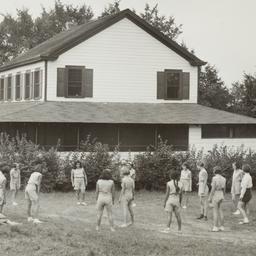 Girls Playing near Cabin