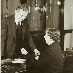 Woman Inspecting Glasses