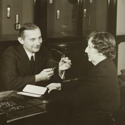 Man Adjusting Eyeglasses fo...