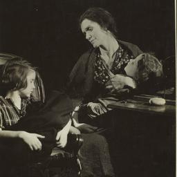 Woman with Children near Desk