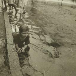 Child in Water near Curb