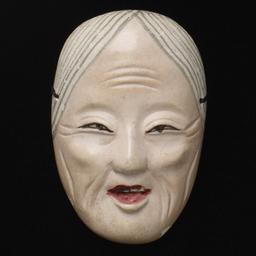 Small Mask Of Elderly Woman