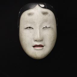 Small Mask Of Young Woman