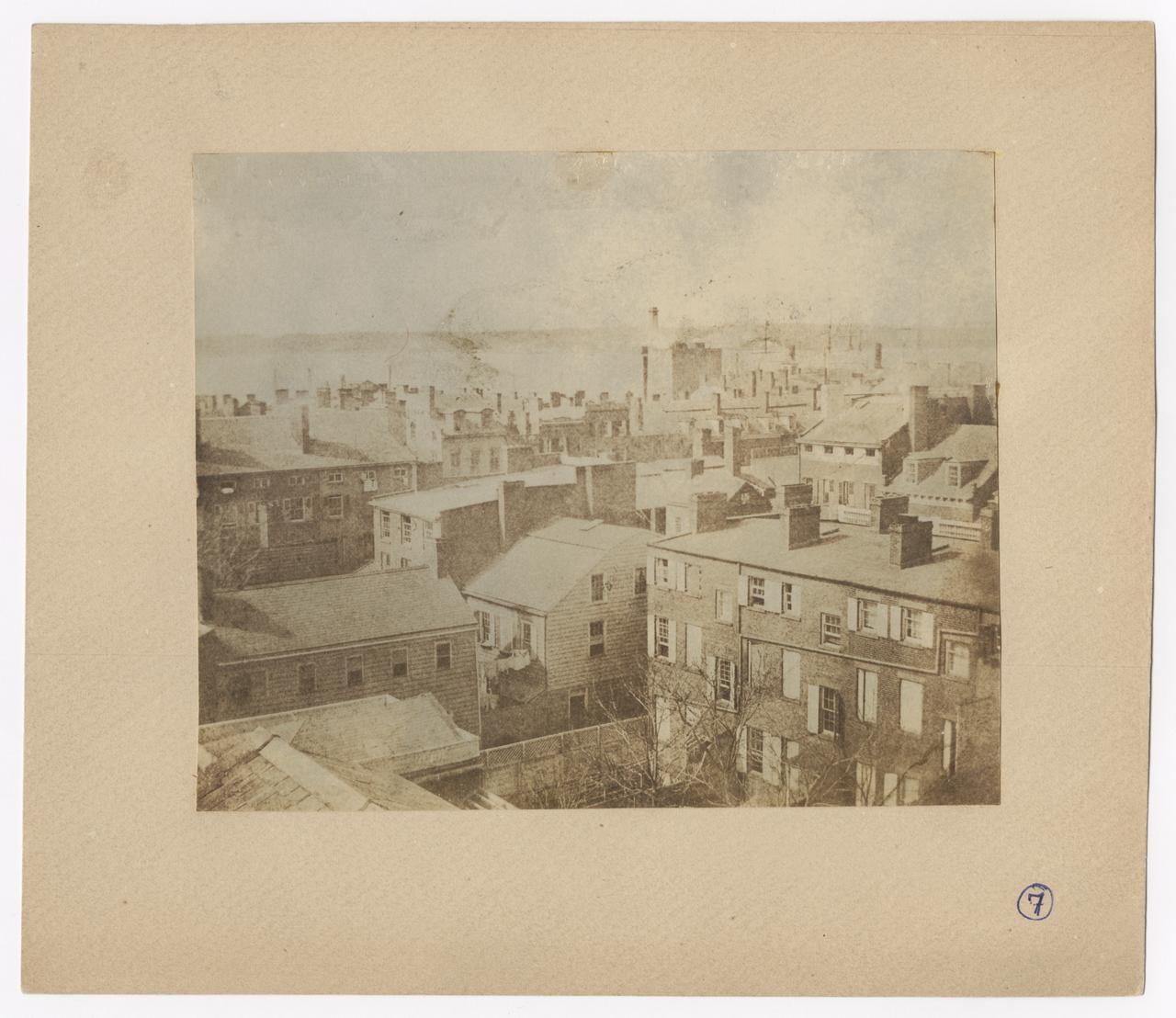View of tops of houses, towards the Hudson River.