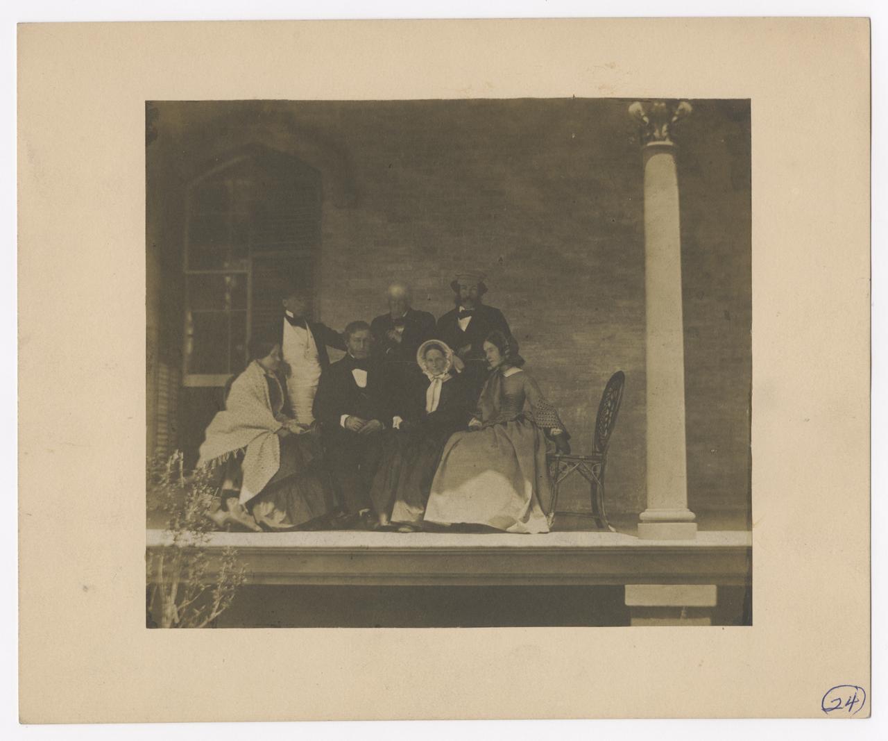 Four Men and Three Women on a porch.