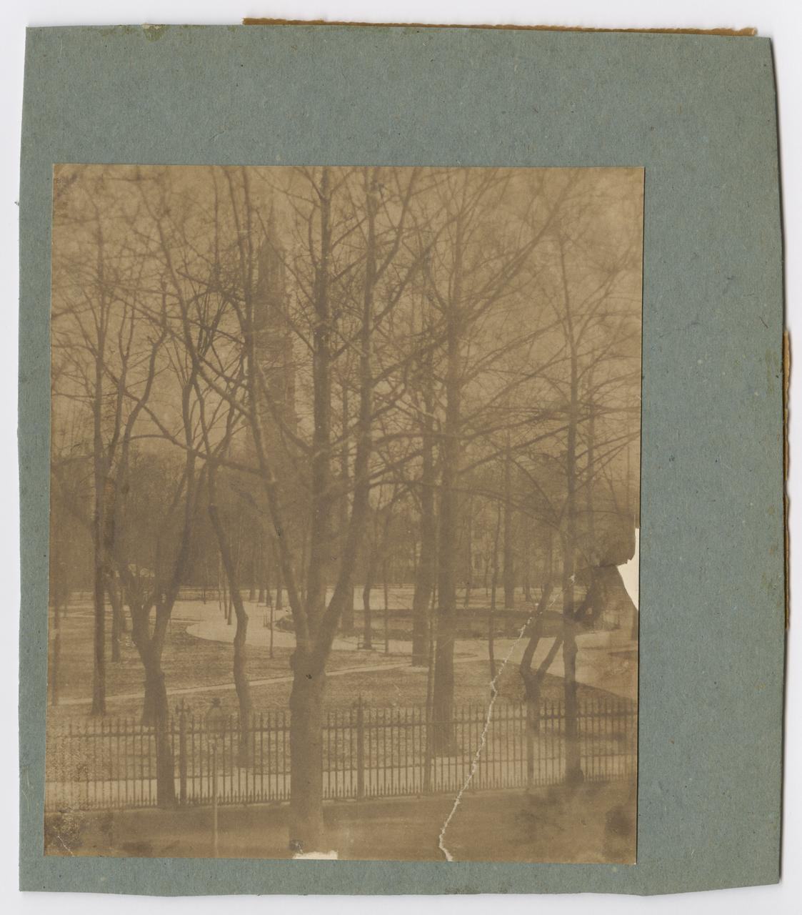 View of St. John's Chapel and park, with trees without leaves.
