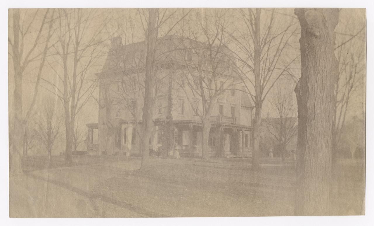 View of a house and grounds in the winter.