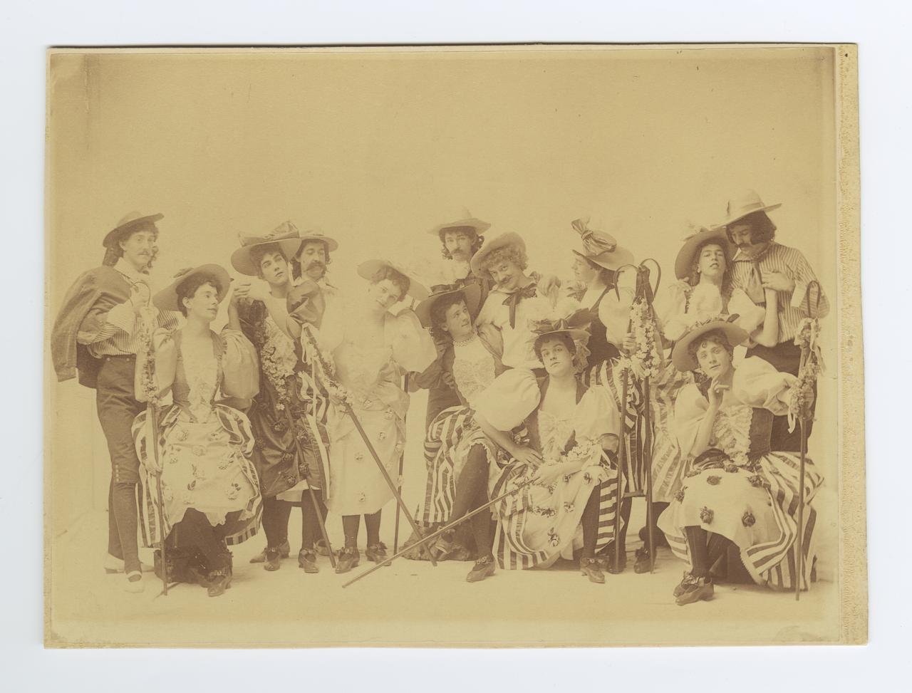 An image of 13 young men in stage costumes for 1894 Varsity Show Joan of Arc